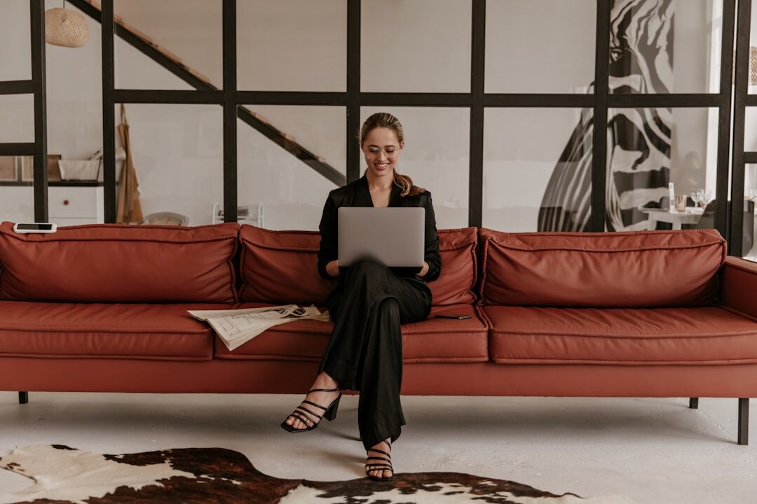 Czech female sociologist analyzing survey data on a laptop